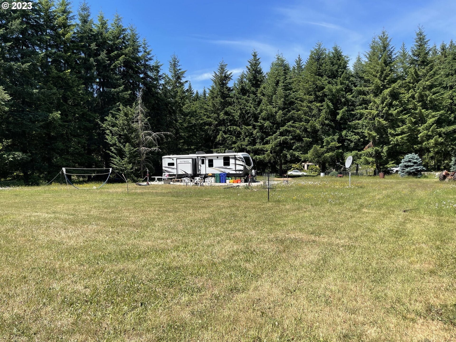 38971 Southeast Rude Road Sandy, OR 97055 - Photo 15 of 46 a view of a field with trees in the background