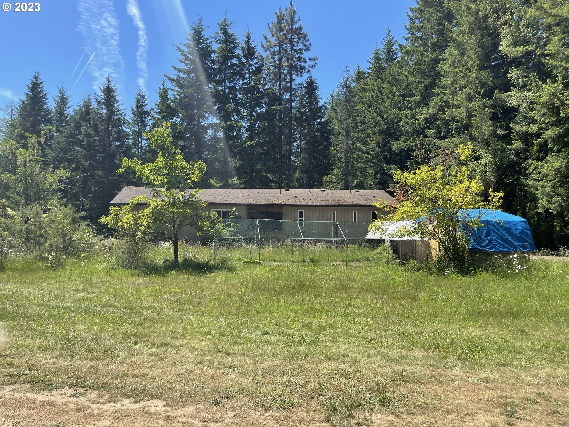 38971 Southeast Rude Road Sandy, OR 97055 - Photo 22 of 46 a backyard of a house with table and chairs