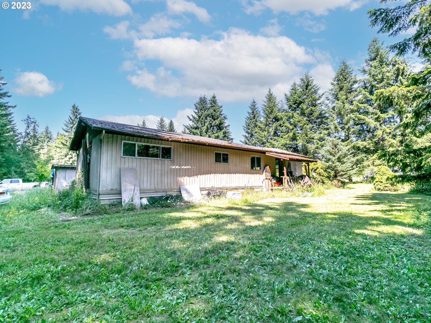 38971 Southeast Rude Road Sandy, OR 97055 - Photo 23 of 46 a backyard of a house with table and chairs