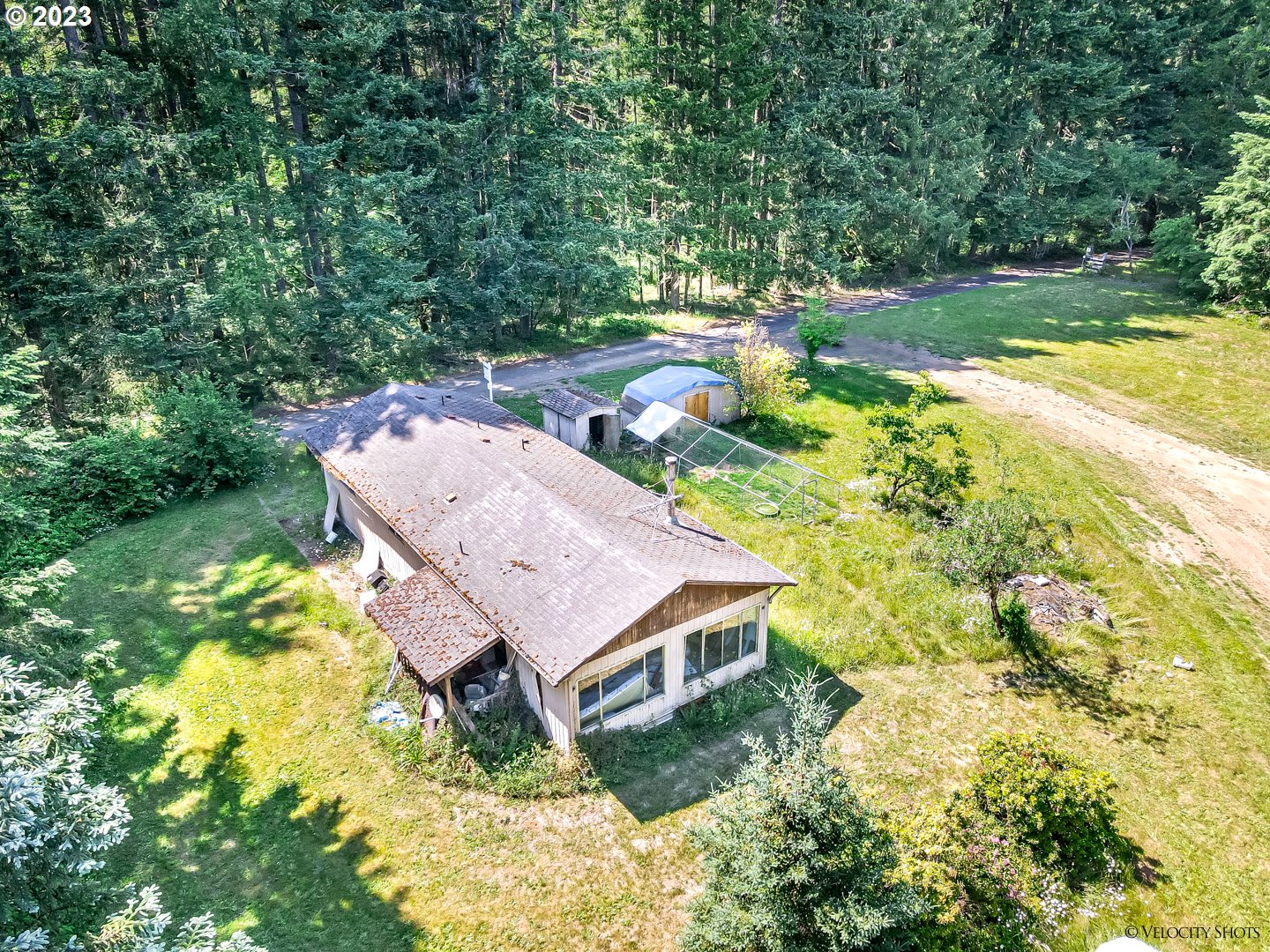38971 Southeast Rude Road Sandy, OR 97055 - Photo 24 of 46 an aerial view of a house with swimming pool and large trees