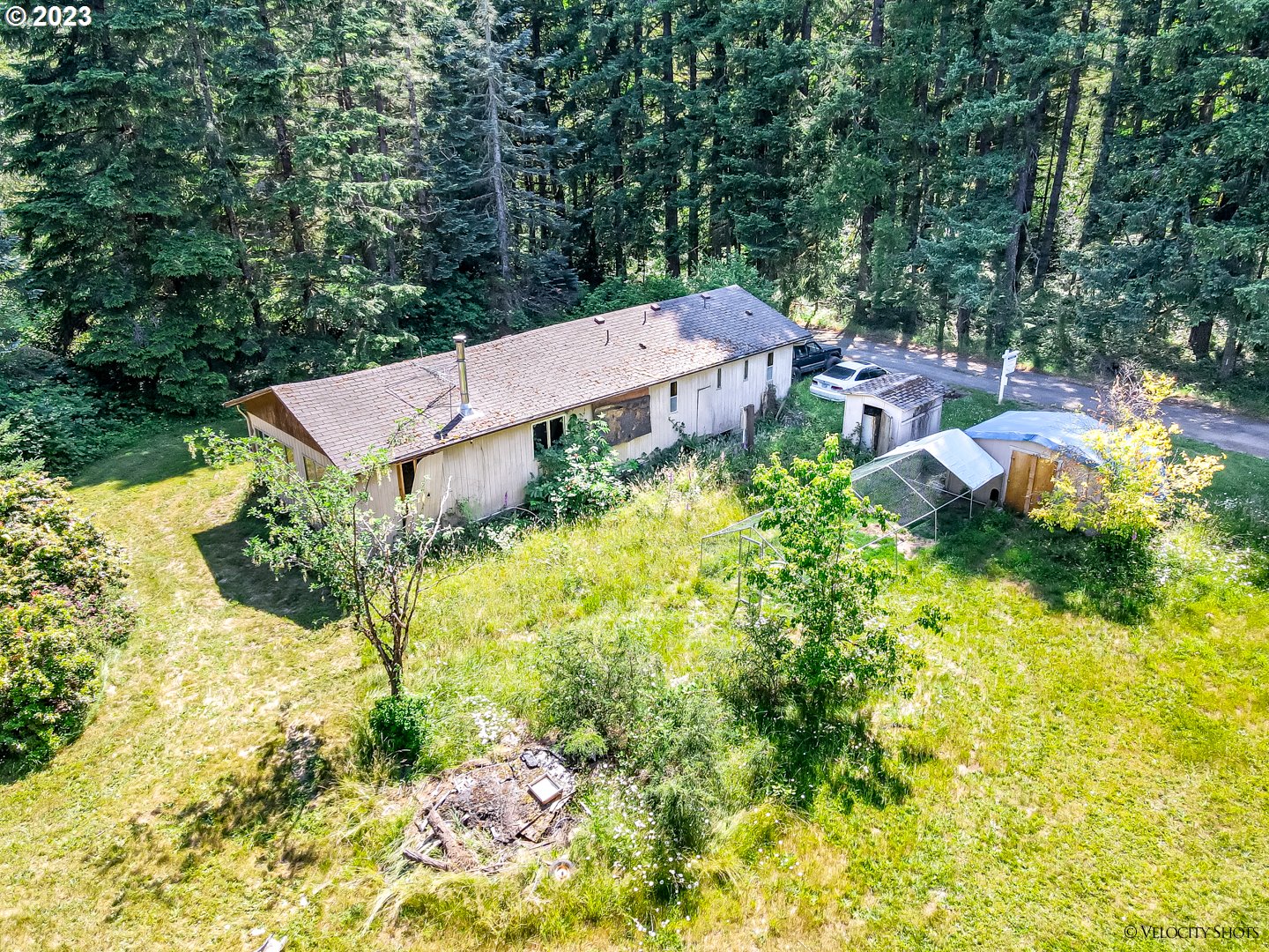 38971 Southeast Rude Road Sandy, OR 97055 - Photo 26 of 46 an aerial view of a house with swimming pool and lawn chairs