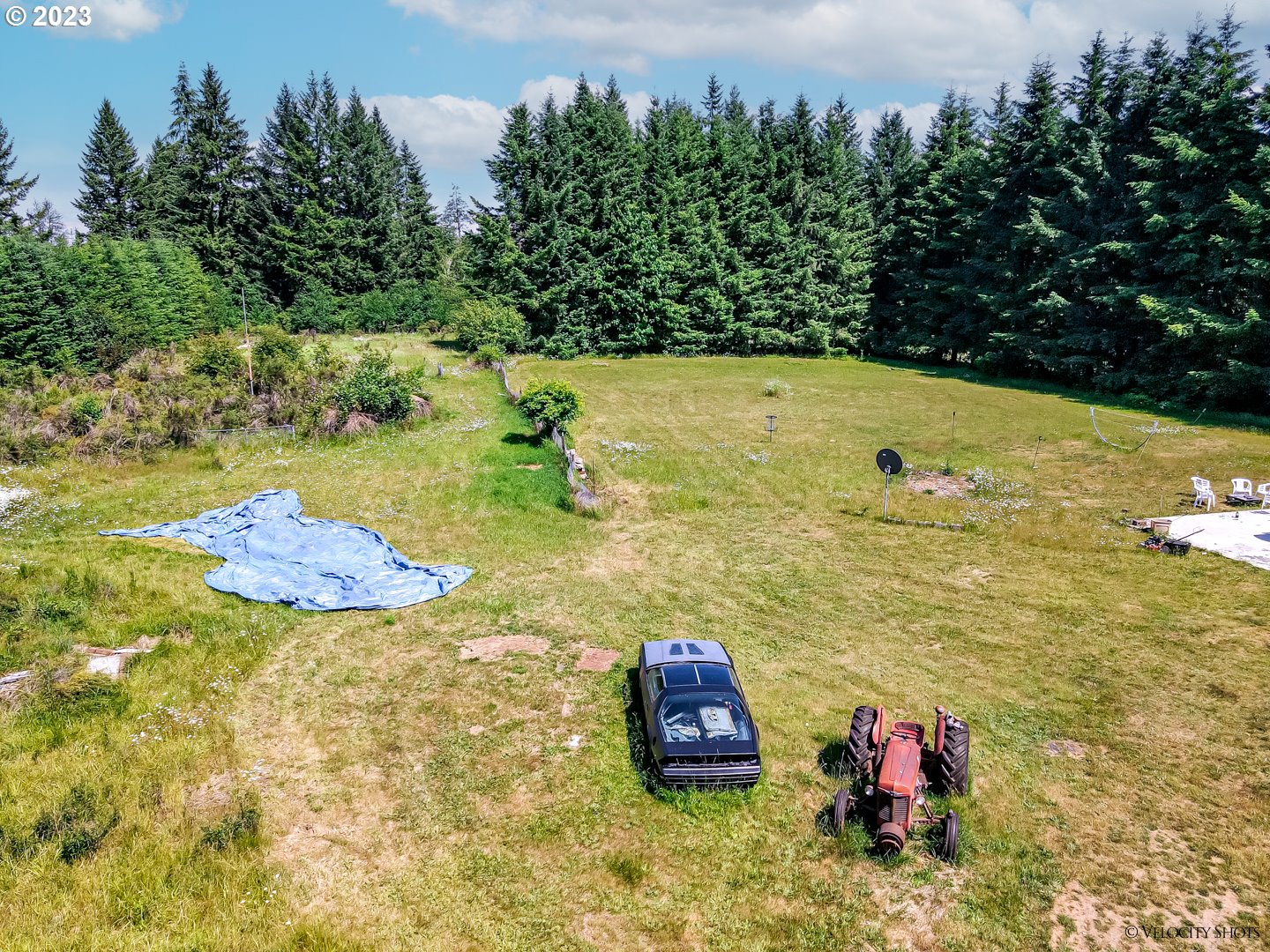 38971 Southeast Rude Road Sandy, OR 97055 - Photo 45 of 46 a view of a room with a fire pit and trees in the background