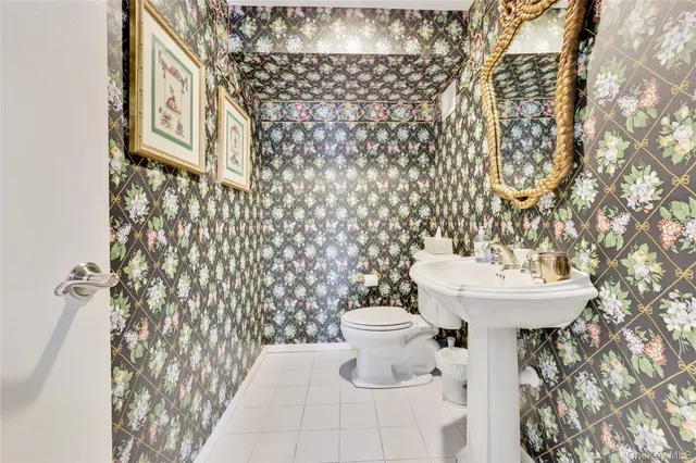 a white toilet sitting next to a shower curtain