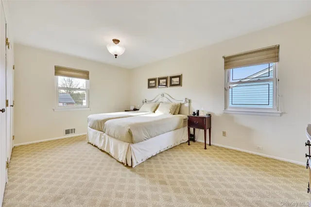 a bedroom with a bed and a table