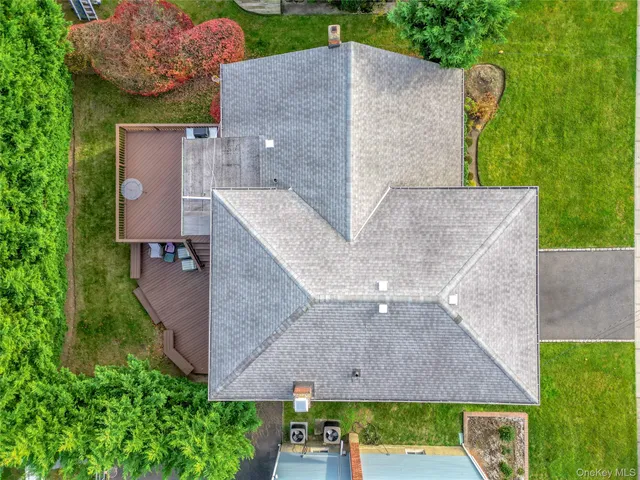 an aerial view of a house with a garden