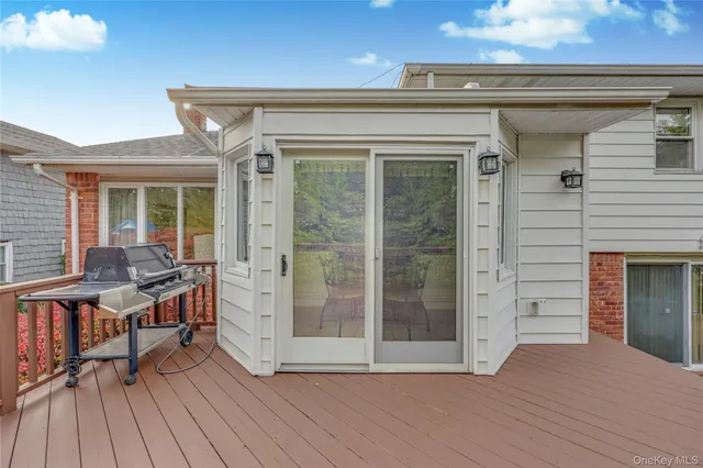a balcony view with a seating space