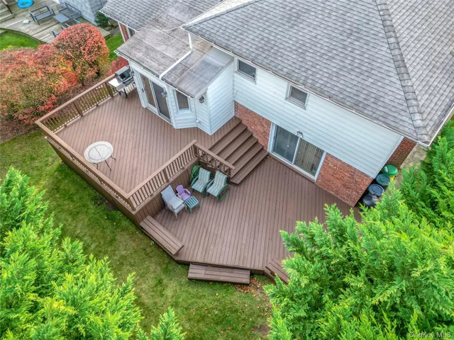 an aerial view of a house with garden space and sitting space