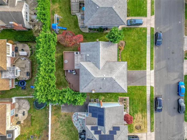 an aerial view of a house with a garden and trees