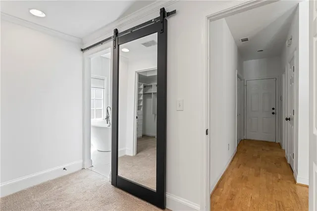 a view of a bathroom with a glass shower door