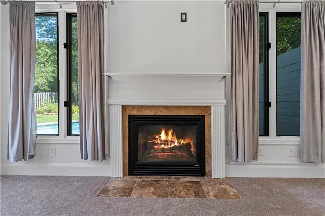 a view of an empty room with a fireplace