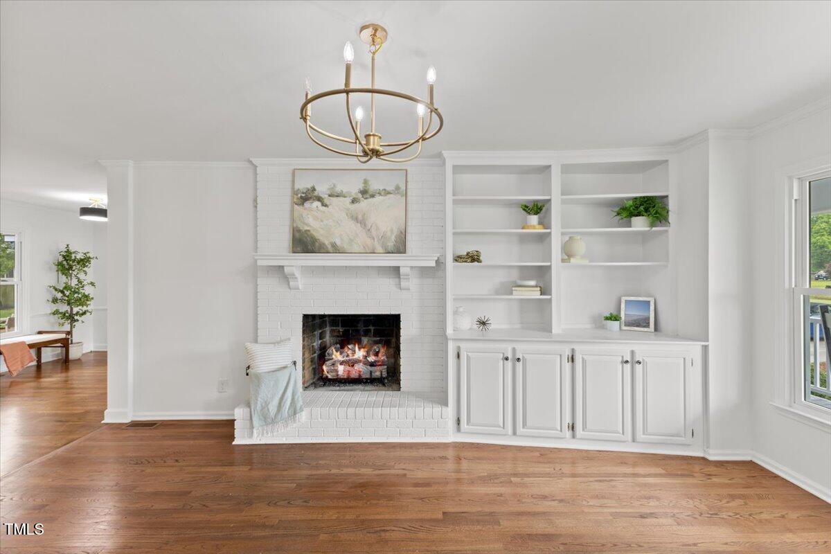 314 Lane Road Dunn, NC 28334 - Photo 10 of 68 a view of a livingroom with furniture wooden floor fire place and a window