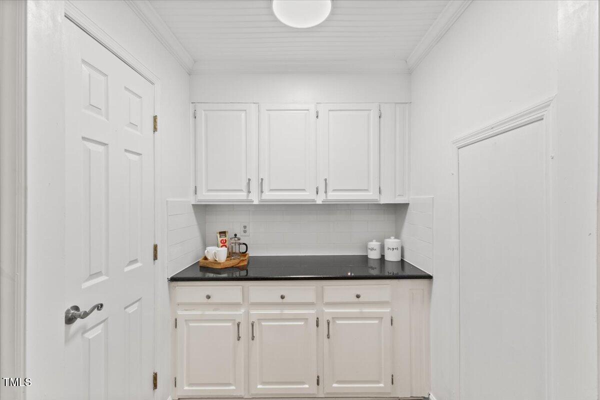 314 Lane Road Dunn, NC 28334 - Photo 28 of 68 a kitchen with white cabinets and sink