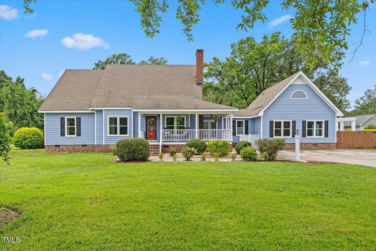 314 Lane Road Dunn, NC 28334 - Photo 2 of 68 a front view of a house with a garden