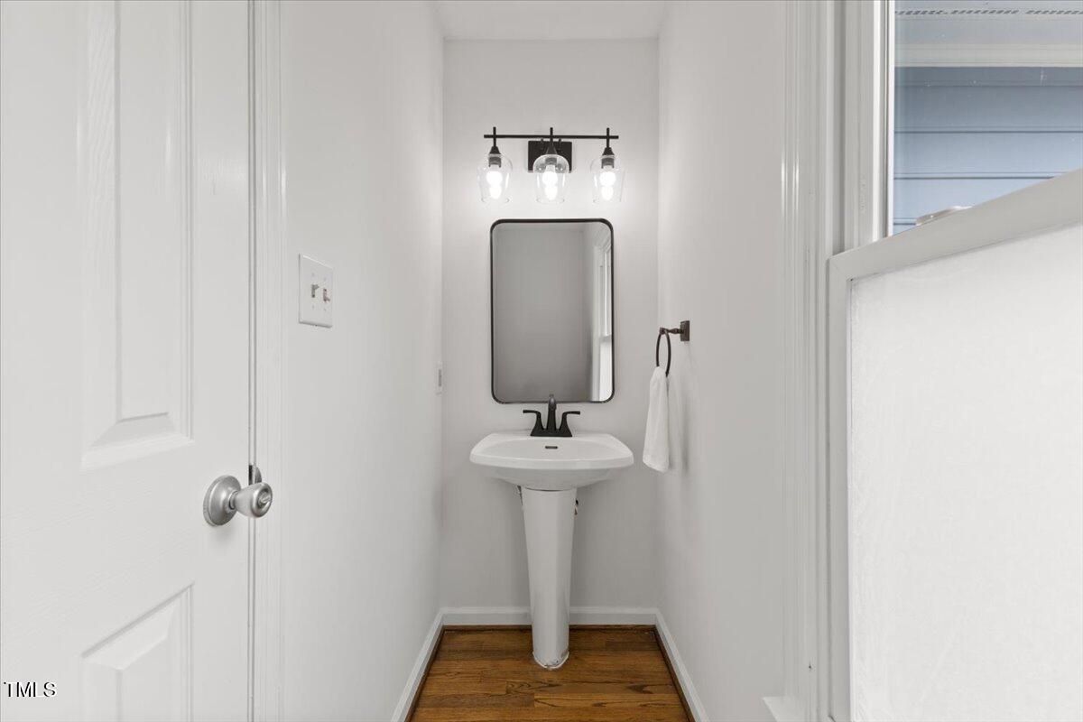 314 Lane Road Dunn, NC 28334 - Photo 34 of 68 a bathroom with a sink and a mirror
