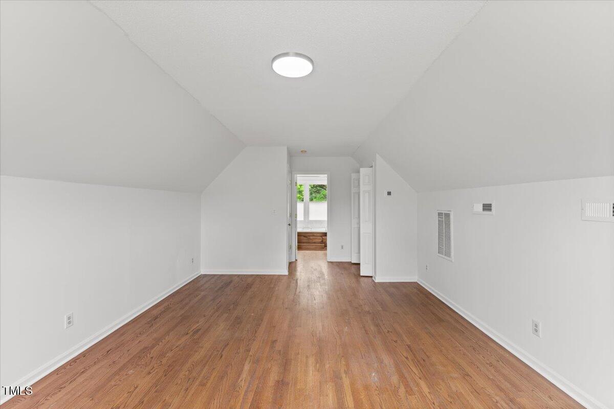 314 Lane Road Dunn, NC 28334 - Photo 48 of 68 a view of an empty room with wooden floor and window