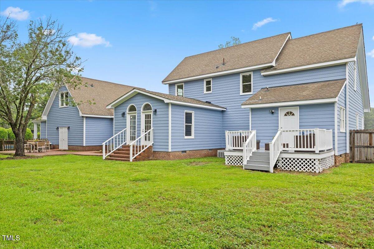 314 Lane Road Dunn, NC 28334 - Photo 56 of 68 a front view of a house with garden and deck