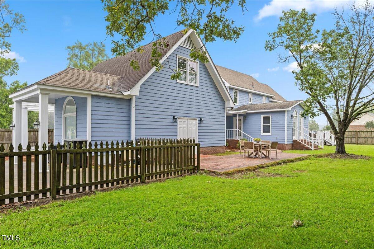 314 Lane Road Dunn, NC 28334 - Photo 64 of 68 a view of a house with a yard and deck