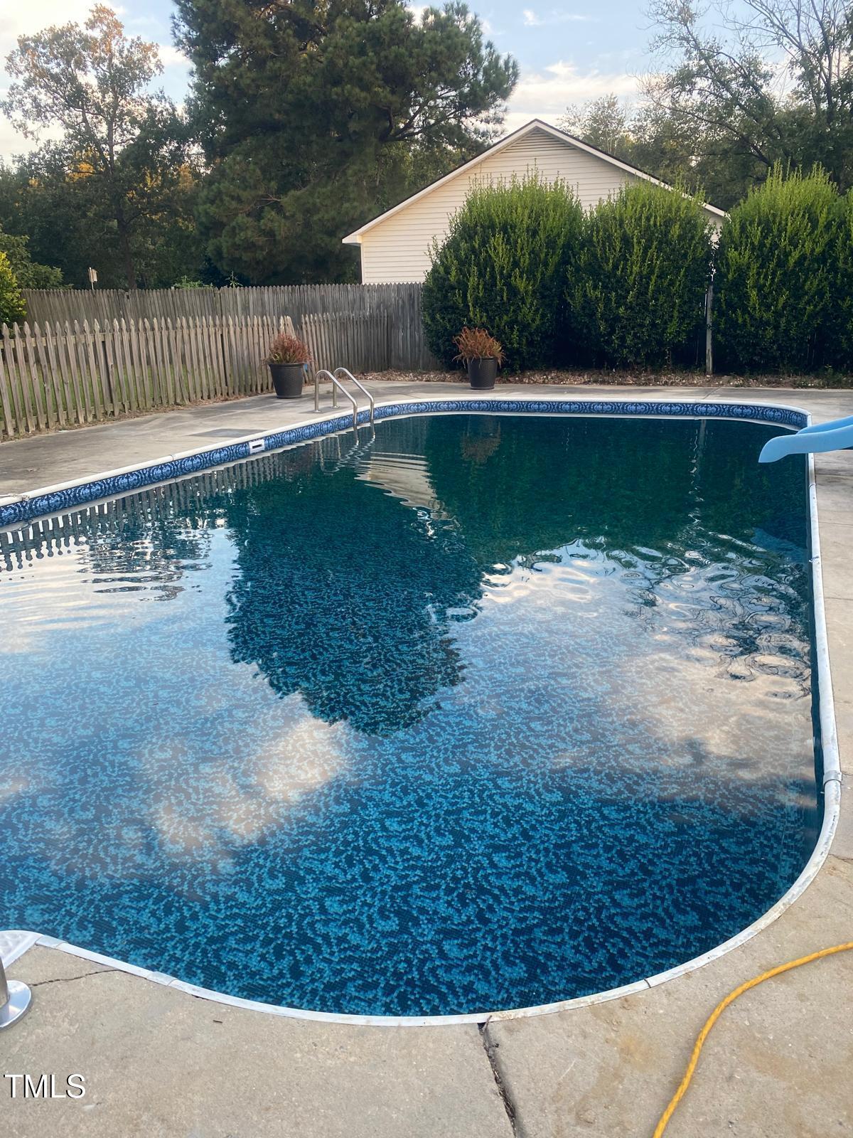 314 Lane Road Dunn, NC 28334 - Photo 66 of 68 a view of a swimming pool with a yard