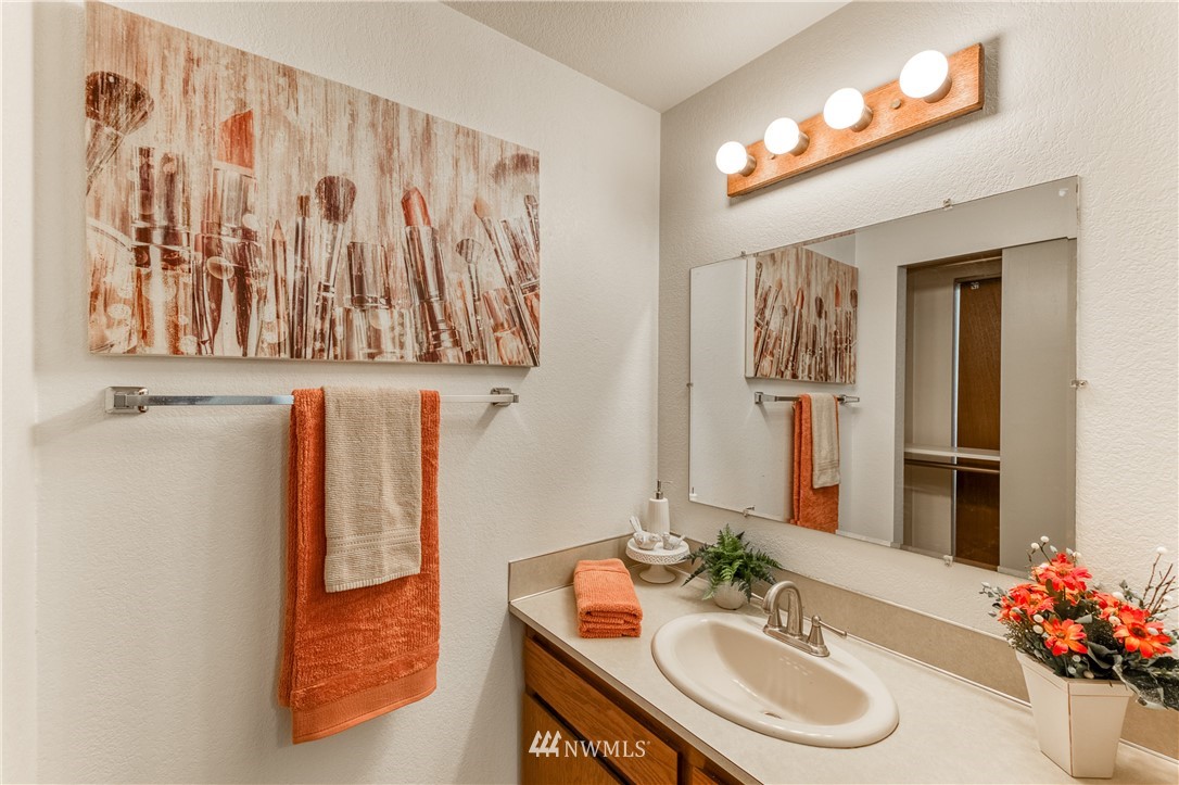 6324 Cady Road, Unit B Everett, WA 98203 - Photo 19 of 22 a bathroom with a sink and a mirror