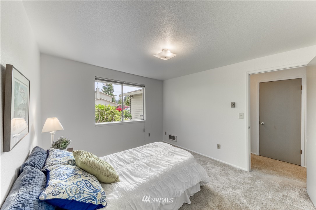 6324 Cady Road, Unit B Everett, WA 98203 - Photo 21 of 22 a bedroom with a bed and a painting on the wall
