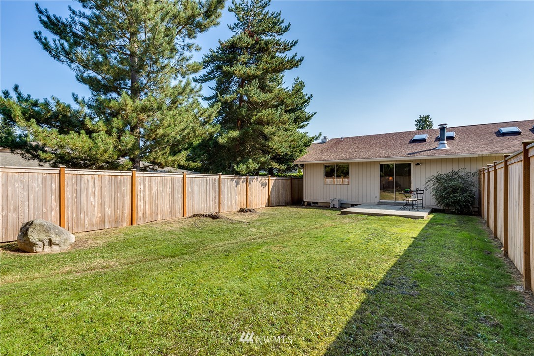 6324 Cady Road, Unit B Everett, WA 98203 - Photo 5 of 22 a front view of a house with a yard and trees