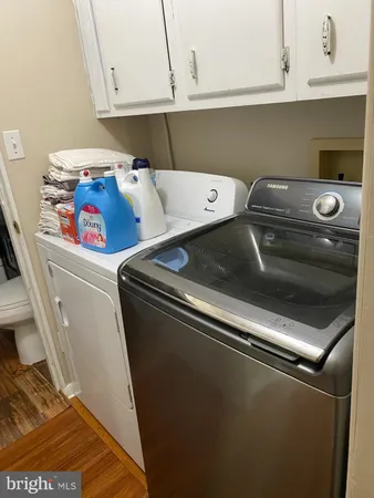 a bathroom with a toilet and a shower curtain