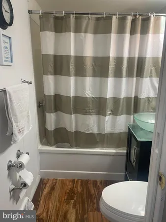 a bedroom with a bed and the painting on the wall