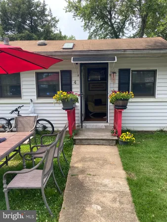 a view of house with outdoor seating