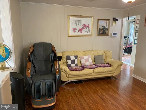 a kitchen with granite countertop a stove cabinets and wooden floor