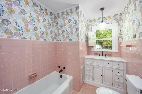 a bathroom with a sink a toilet and a bathtub