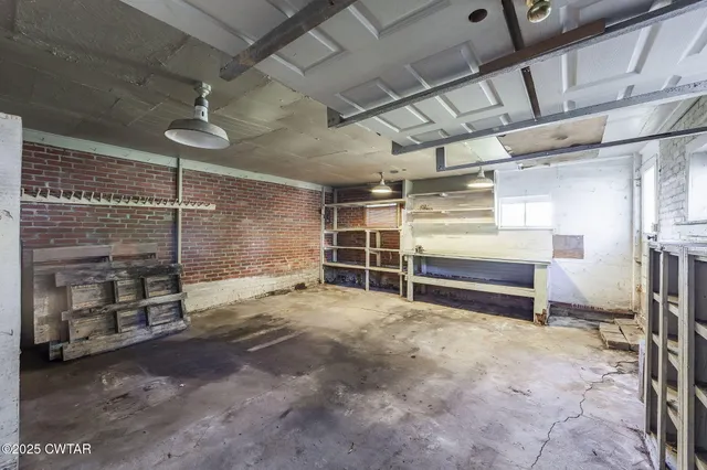a view of a room with wooden shelves
