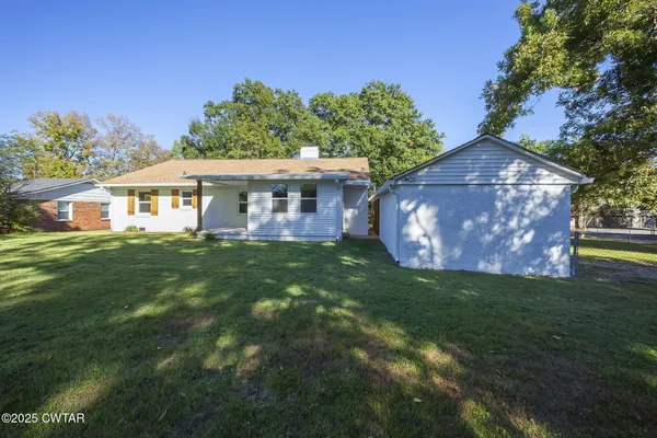 a house view with a garden space