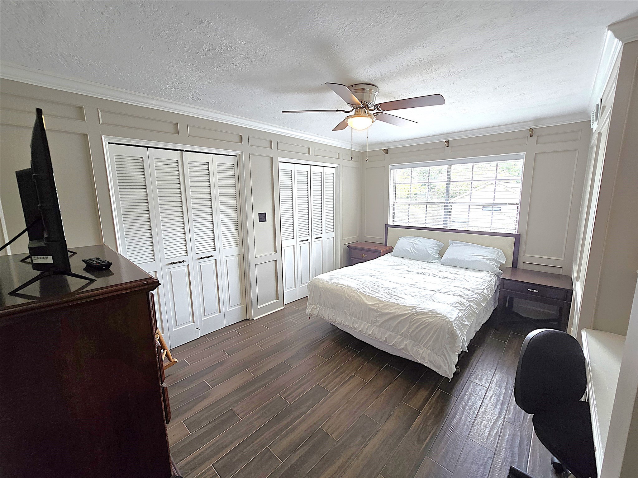 560 Brandon Road Conroe, TX 77302 - Photo 17 of 45 a bedroom with a bed and a flat screen tv