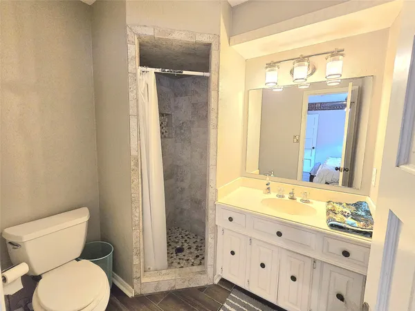 a bathroom with a bathtub and shower