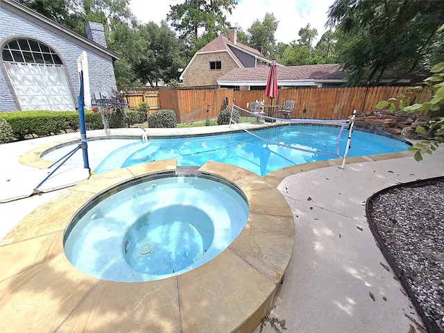 a swimming pool with outdoor space and sitting space