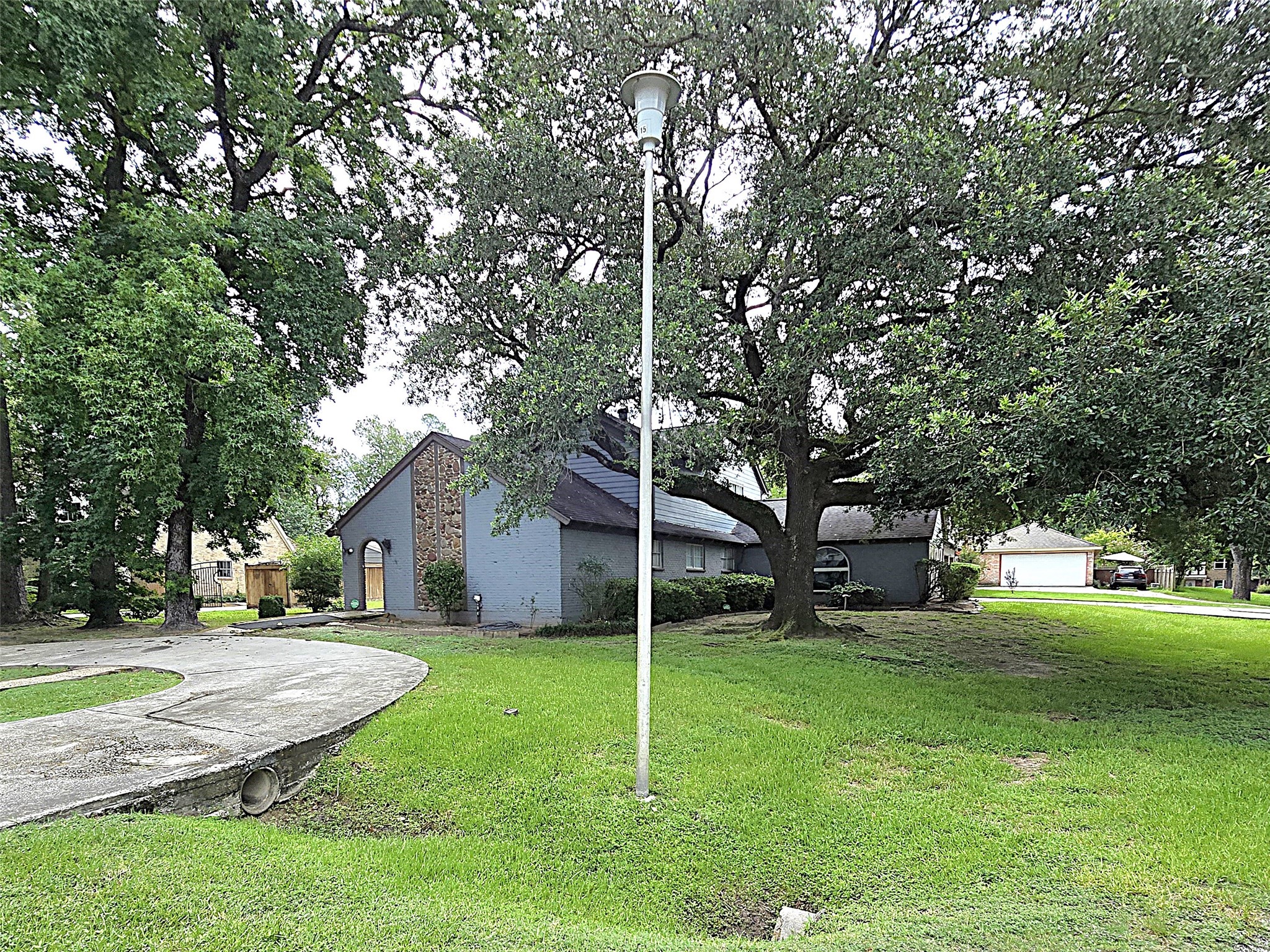 560 Brandon Road Conroe, TX 77302 - Photo 22 of 45 a view of a house with a yard