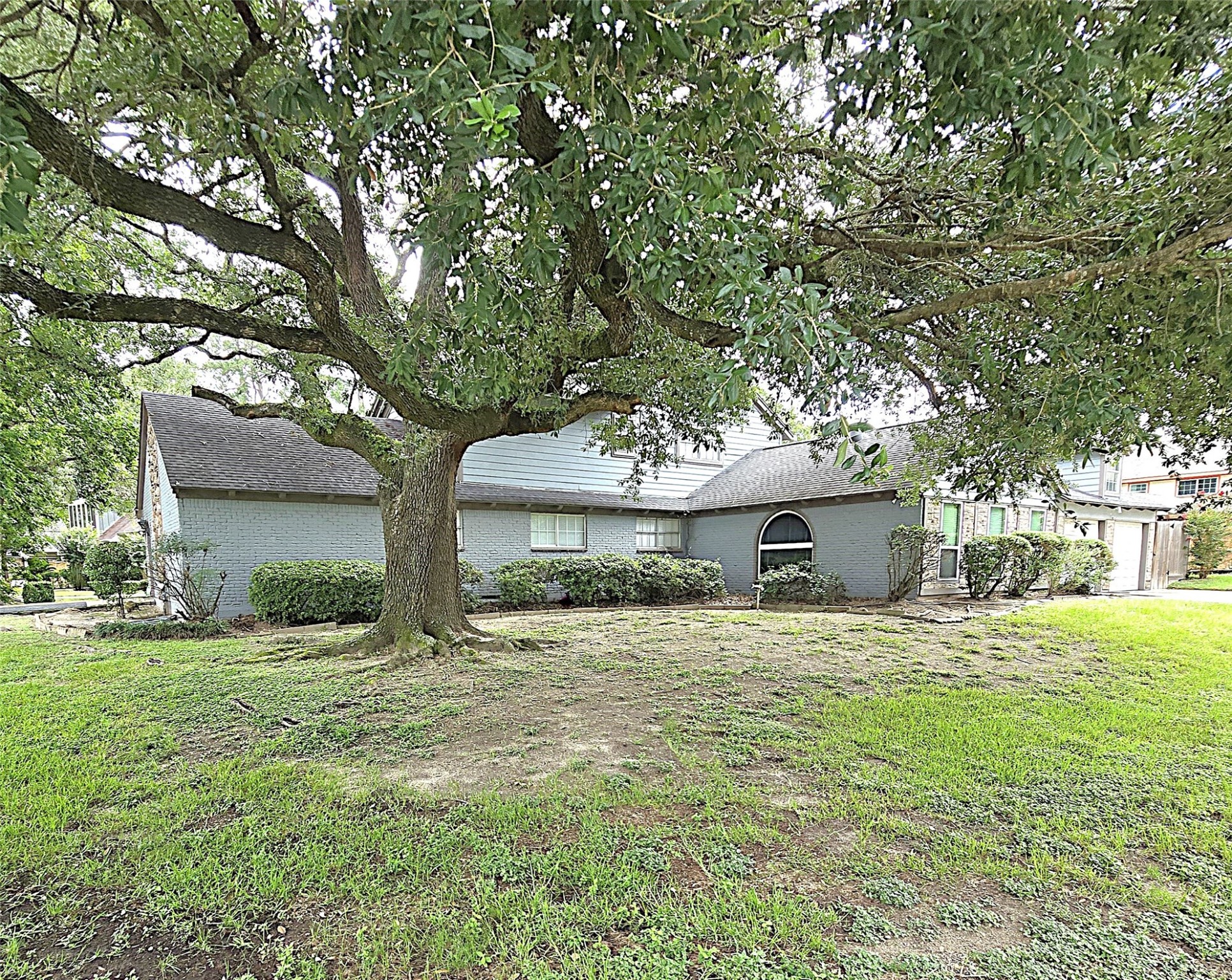 560 Brandon Road Conroe, TX 77302 - Photo 23 of 45 a house that has a tree in front of it