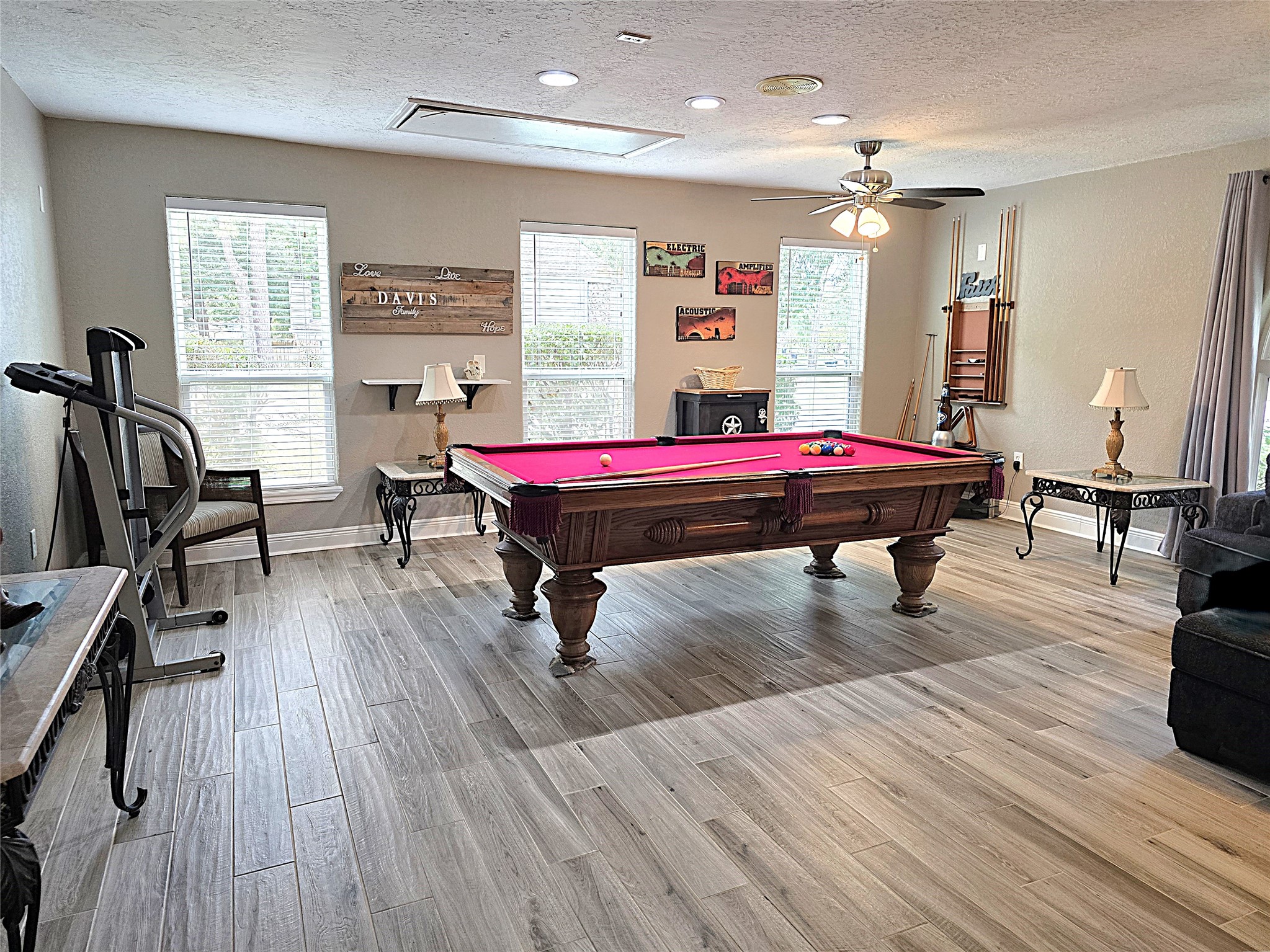 560 Brandon Road Conroe, TX 77302 - Photo 24 of 45 a room with wooden floor pool table furniture and windows