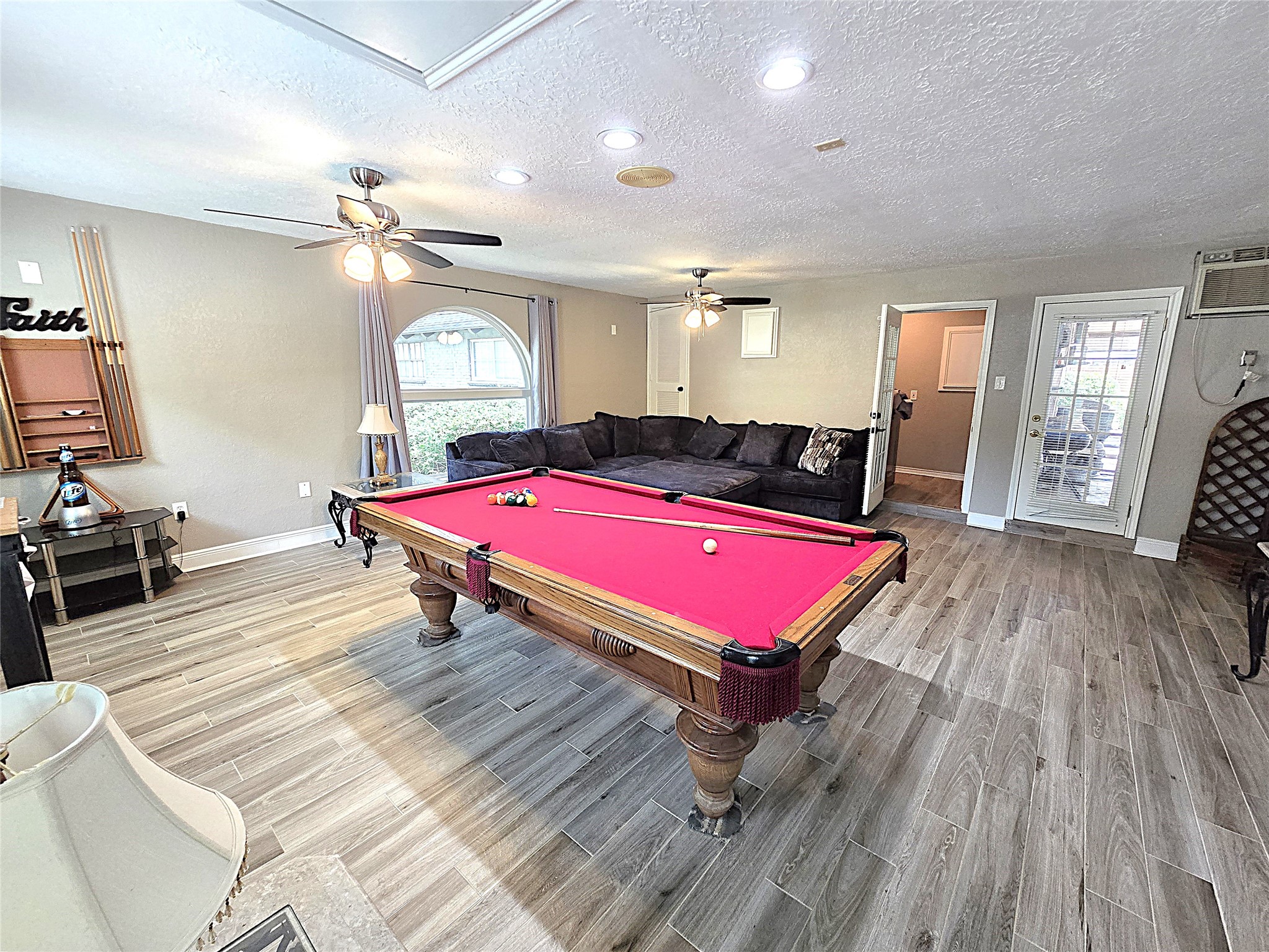 560 Brandon Road Conroe, TX 77302 - Photo 25 of 45 a room with pool table windows wooden floor and front door