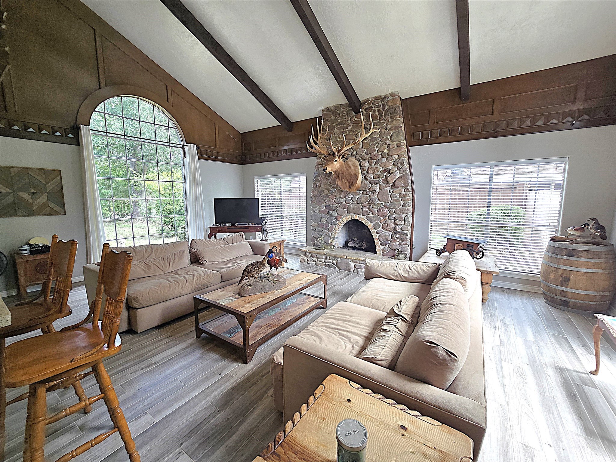 560 Brandon Road Conroe, TX 77302 - Photo 34 of 45 a living room with furniture fireplace and a large window