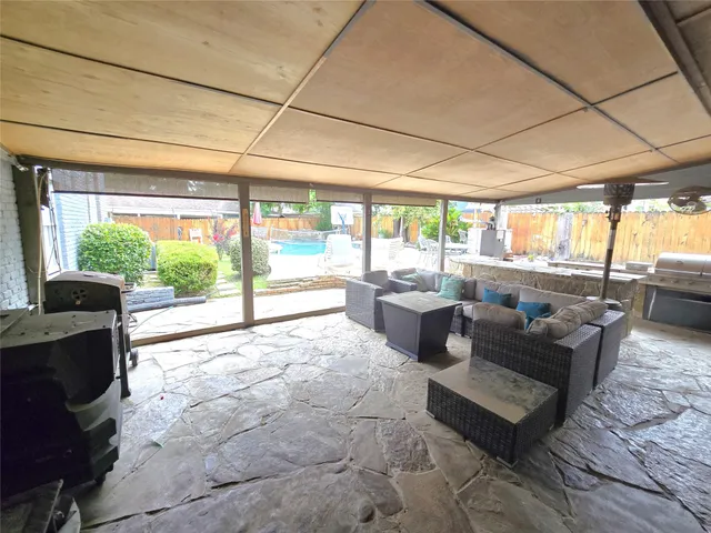 a view of a backyard with sitting area