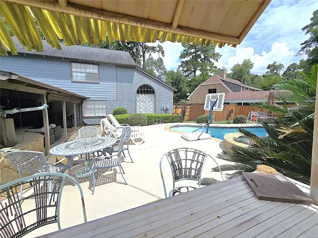 a view of a swimming pool with a lounge chair