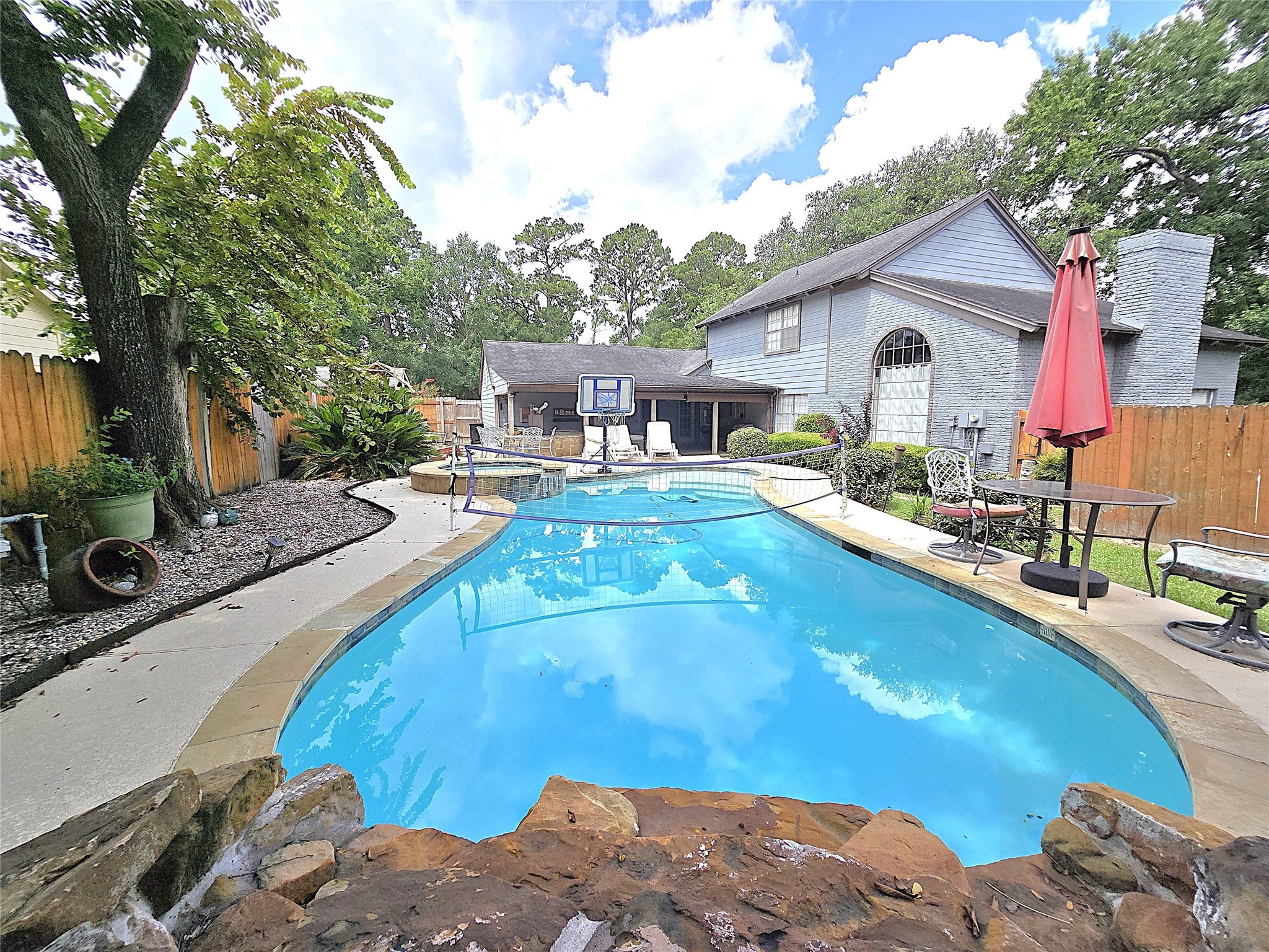 560 Brandon Road Conroe, TX 77302 - Photo 42 of 45 a view of a house with pool and sitting area
