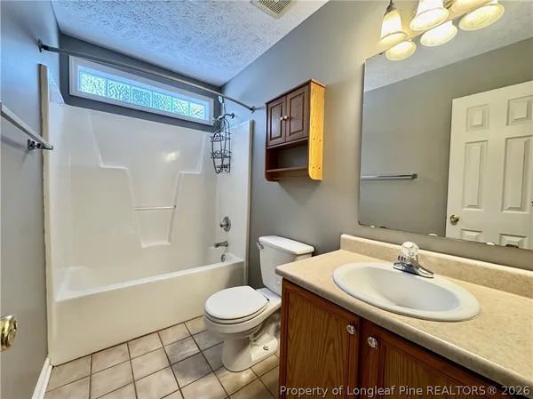 a bathroom with a sink and a shower
