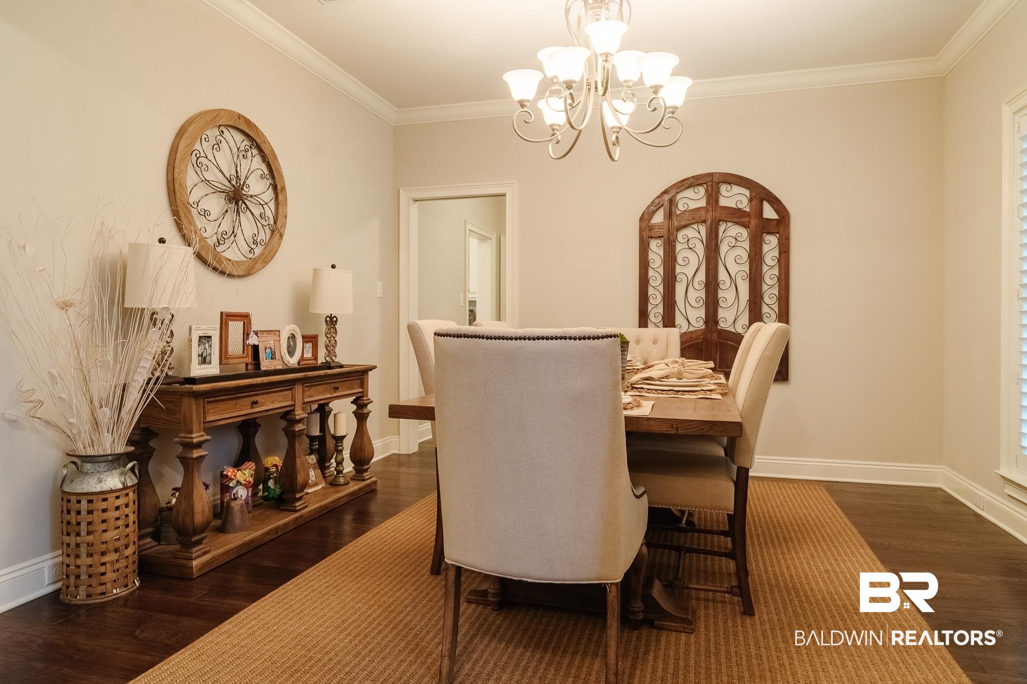 7235 Raleigh Way Mobile, AL 36695 - Photo 5 of 52 Dining space featuring an inviting chandelier, dark wood-style floors, and baseboards