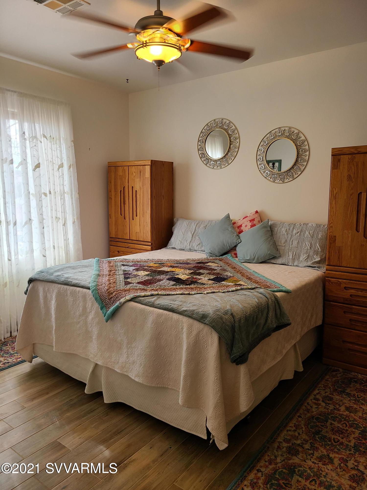 610 Rodeo Road Sedona, AZ 86336 - Photo 12 of 20 a bedroom with a bed and lamp