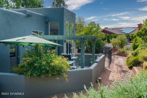 610 Rodeo Road Sedona, AZ 86336 - Photo 17 of 20 a view of a house with pool and garden