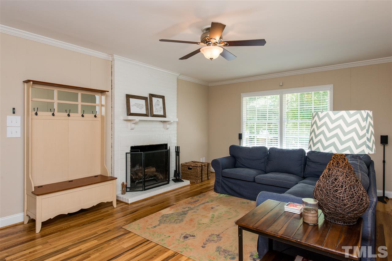 3512 Peach Haven Court Raleigh, NC 27607 - Photo 11 of 25 a living room with furniture and a fireplace