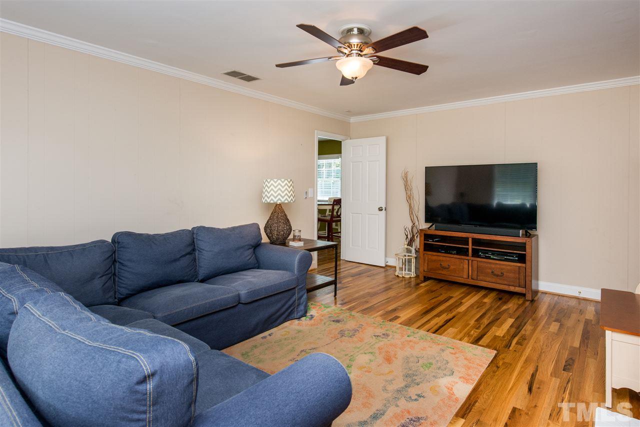 3512 Peach Haven Court Raleigh, NC 27607 - Photo 12 of 25 a living room with furniture and a flat screen tv