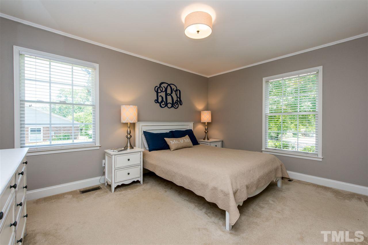 3512 Peach Haven Court Raleigh, NC 27607 - Photo 15 of 25 a bed sitting in a bedroom next to a window